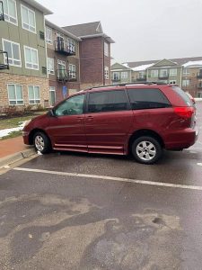 Maroon Toyota Sienna van parked outdoors