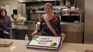 Ann Genosky of the Mary Ann Young Senior Center poses with her retirement cake.