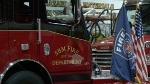 An SBM Fire Department fire truck parked inside the fire station.