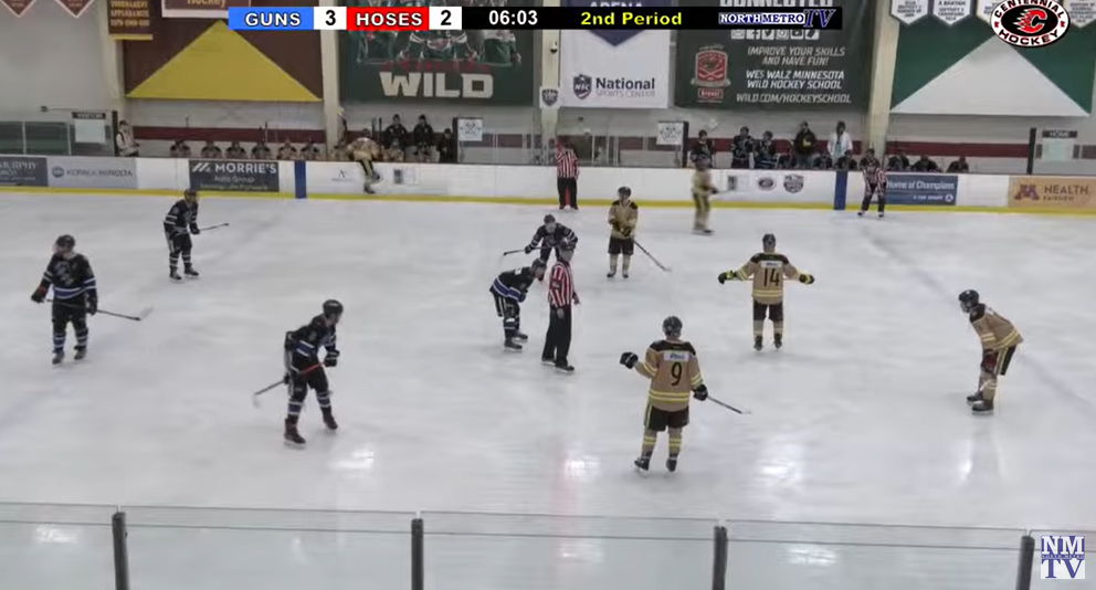 Police officers square off against firefighters in the Guns N Hoses hockey match.
