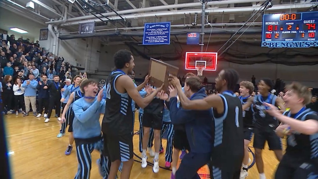 The Blaine High School Boys Basketball team celebrates their section championship win.