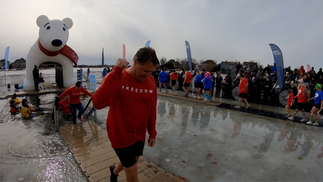 Swimmers emerge from the freezing water at this year's Anoka County Polar Plunge.